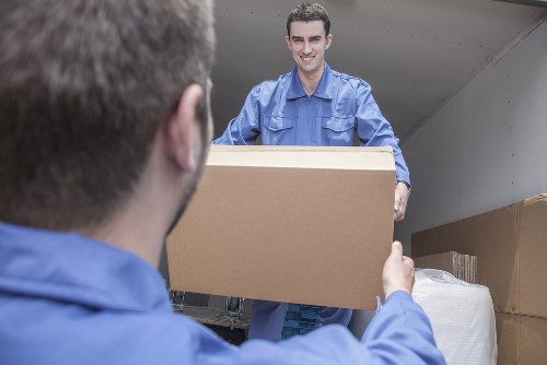 Moving van and packed boxes for a Wimbledon home move
