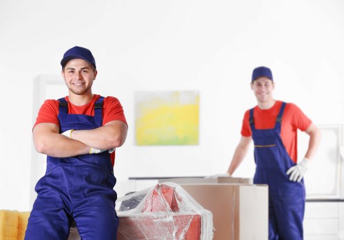 Professional Wimbledon movers handling boxes during a home relocation