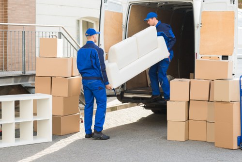 Man and van loading boxes for a flat move in Wimbledon