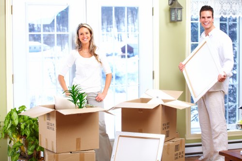 Packed moving boxes and furniture protection for a Wimbledon property