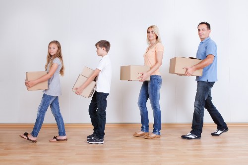 Professional removal team handling boxes and furniture in Wimbledon