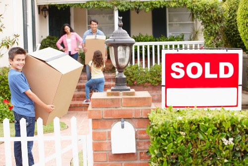 Packed moving boxes and furniture ready for transport in Wimbledon
