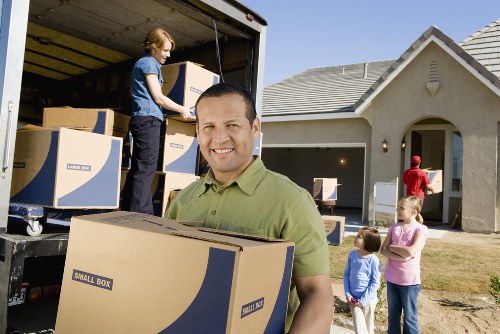 Business movers packing office equipment for a Wimbledon relocation