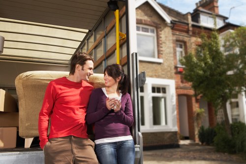 Professional movers handling furniture during an urgent relocation