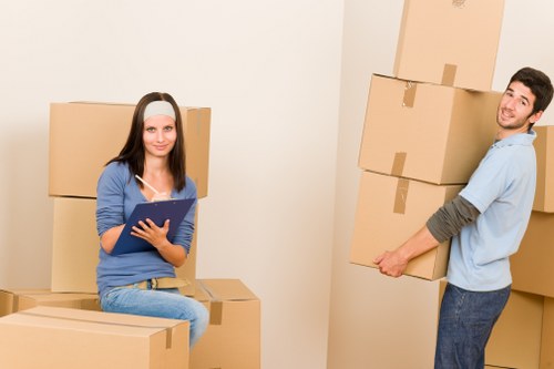 Furniture and boxes being moved from a Wimbledon flat with stair access